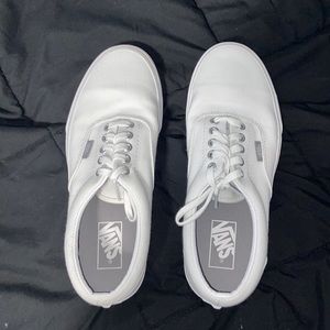 These are a women’s size 9.5 pair a white tie vans